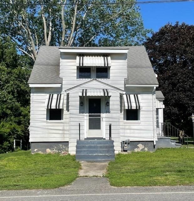 912 Pleasant St, Somerset, MA 02726 - view of front of home with a front yard and a shingled roof