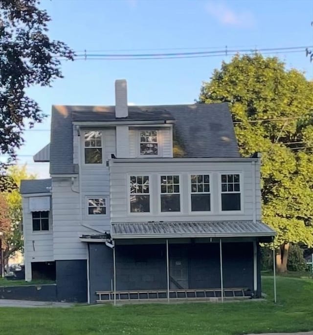 912 Pleasant St, Somerset, MA 02726 - back of property with a lawn and a chimney