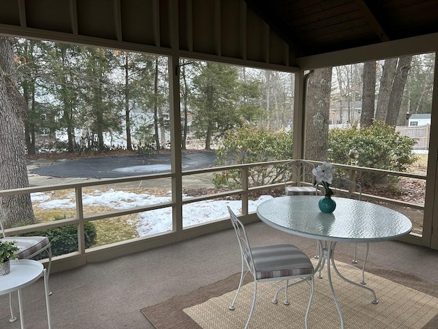 unfurnished sunroom with vaulted ceiling