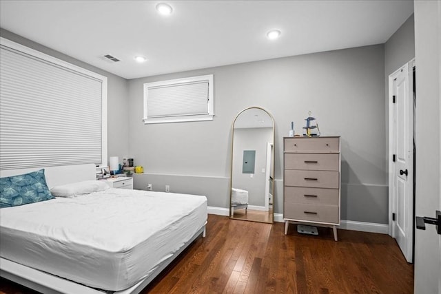 bedroom featuring dark wood-style floors, baseboards, and recessed lighting