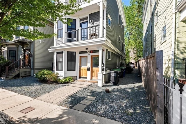 view of front of house featuring a balcony