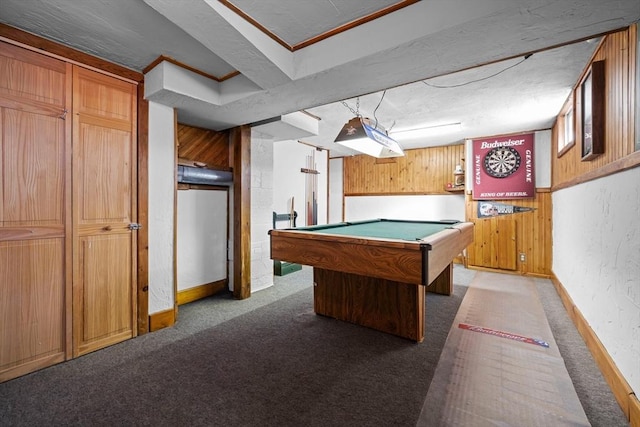 game room with dark carpet, pool table, and wood walls