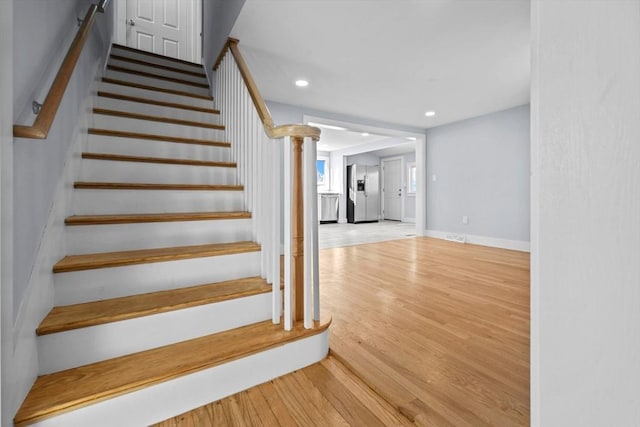 stairway with wood-type flooring