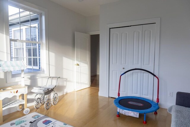 interior space with baseboards and wood finished floors