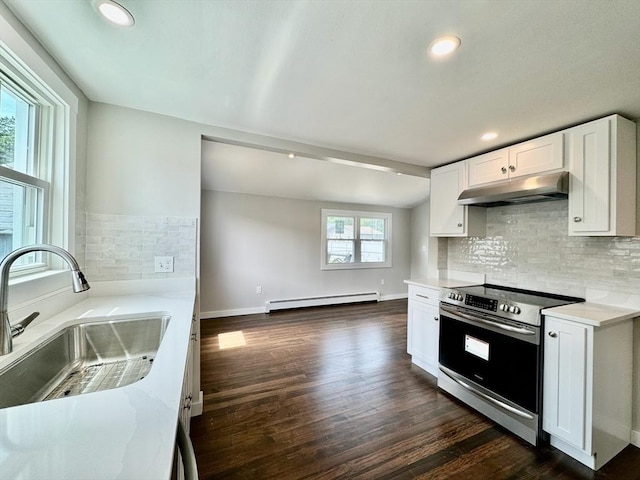 kitchen with a baseboard heating unit, sink, white cabinets, and electric stove