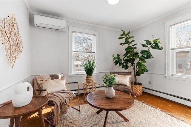 sitting room featuring plenty of natural light, ornamental molding, wood finished floors, and a wall mounted AC