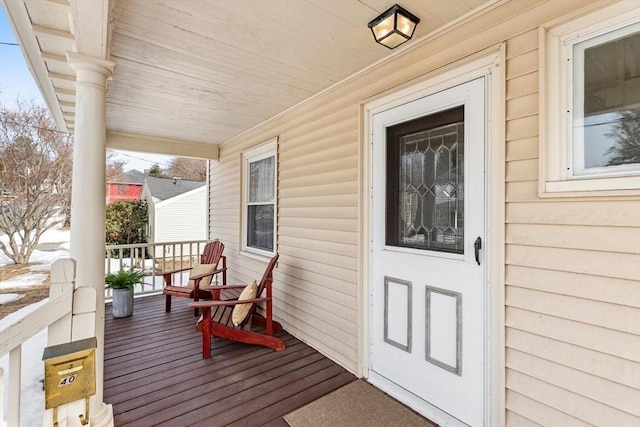 doorway to property with covered porch