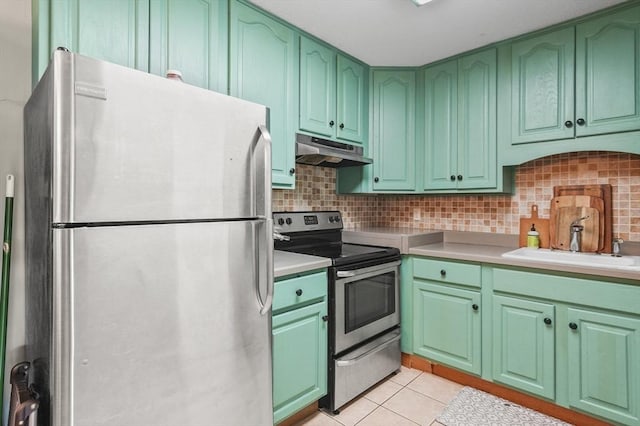 7 Thayer Pond Dr Unit 11, Oxford, MA 01537 - kitchen with appliances with stainless steel finishes, under cabinet range hood, decorative backsplash, and green cabinets
