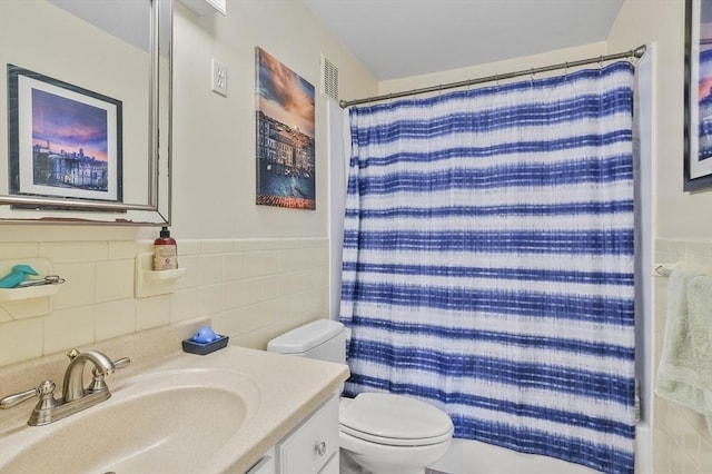 7 Thayer Pond Dr Unit 11, Oxford, MA 01537 - full bath with vanity, tile walls, curtained shower, and a wainscoted wall