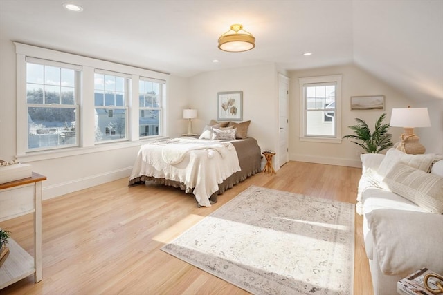 bedroom featuring vaulted ceiling, recessed lighting, wood finished floors, and baseboards