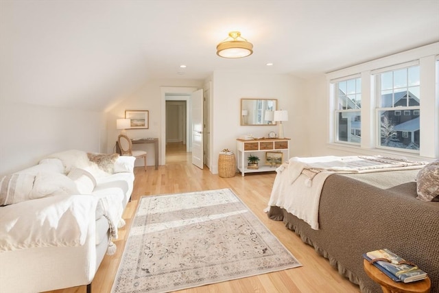 bedroom featuring vaulted ceiling, recessed lighting, and light wood-style floors