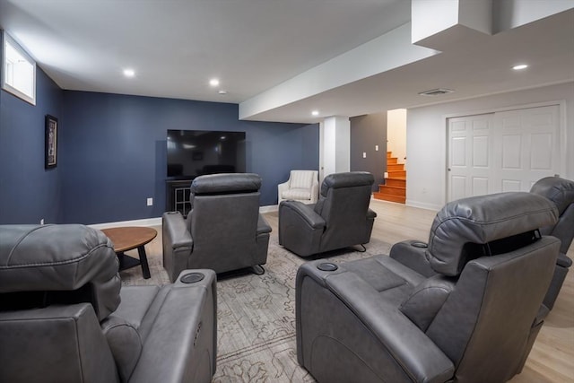 home theater featuring light wood-type flooring, visible vents, baseboards, and recessed lighting