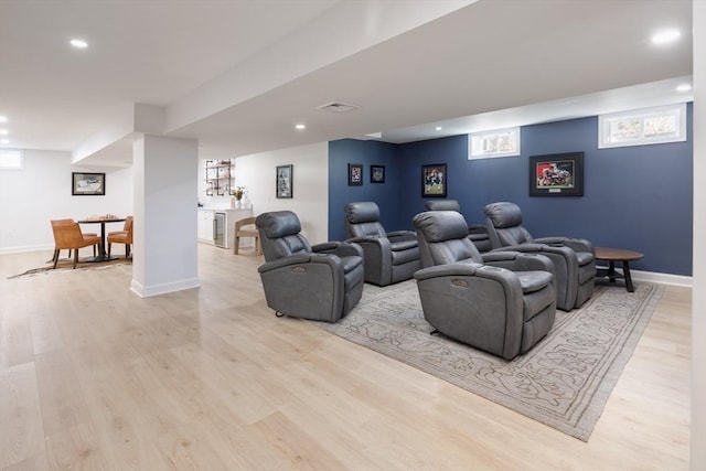 cinema with baseboards, recessed lighting, visible vents, and light wood-style floors