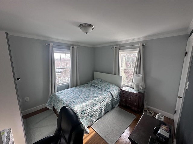 28 Roberts St, Malden, MA 02148 - bedroom featuring multiple windows, wood finished floors, crown molding, and baseboards
