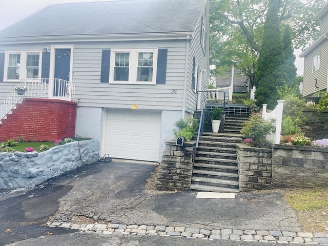 28 Roberts St, Malden, MA 02148 - view of front of home featuring stairs, an attached garage, and driveway
