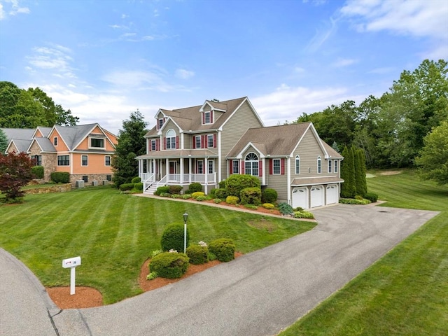 75 Birchwood Rd, Tewksbury, MA 01876 - view of front of home with a porch, a garage, and a front lawn
