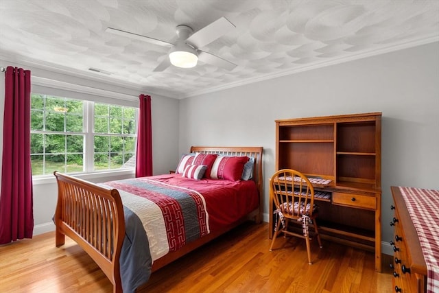 75 Birchwood Rd, Tewksbury, MA 01876 - bedroom with crown molding, light wood-type flooring, and a ceiling fan
