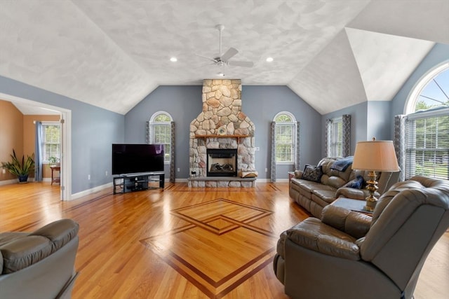 75 Birchwood Rd, Tewksbury, MA 01876 - living area with a ceiling fan, lofted ceiling, wood finished floors, and a fireplace