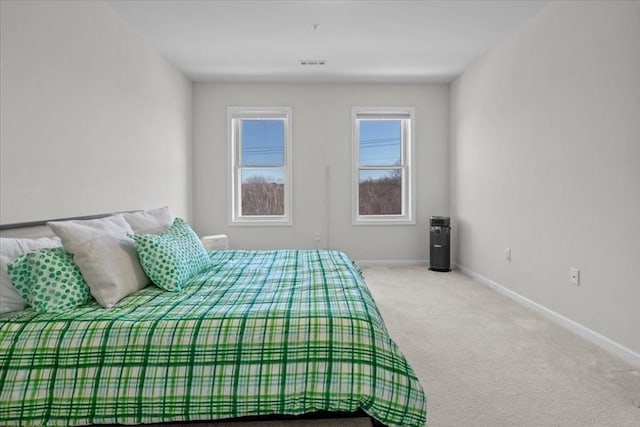 bedroom featuring carpet flooring, baseboards, and visible vents