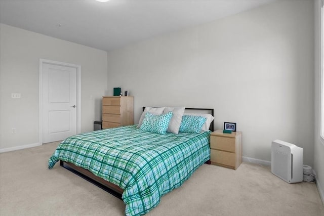 carpeted bedroom with baseboards