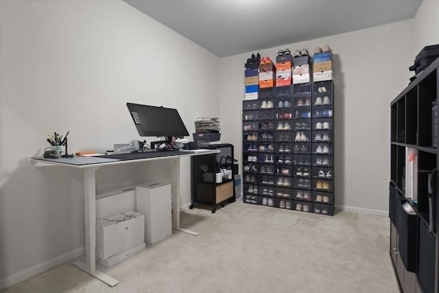 home office featuring baseboards and carpet