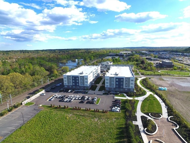 birds eye view of property with a wooded view