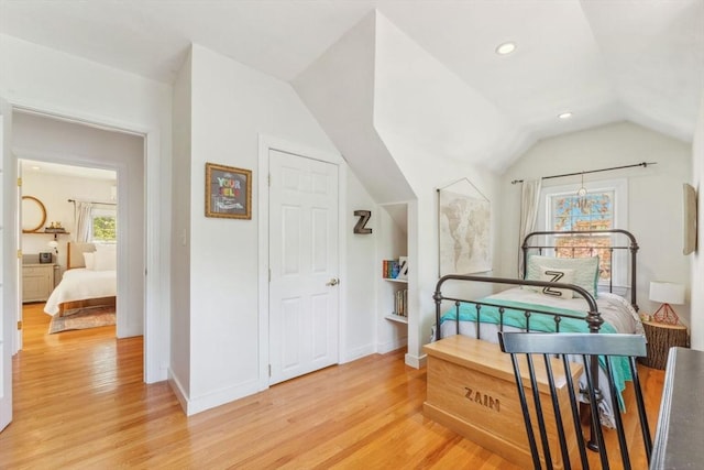 bedroom with light wood-type flooring, recessed lighting, baseboards, and vaulted ceiling