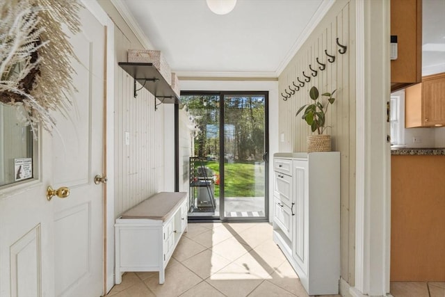 mudroom featuring light tile patterned flooring and ornamental molding