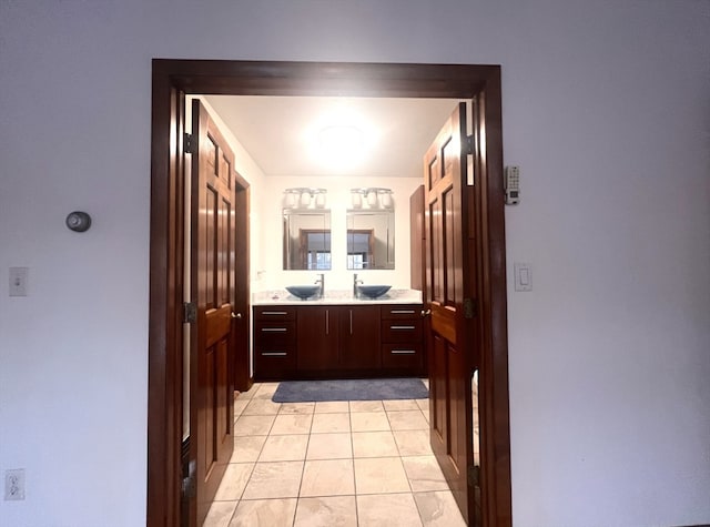 bathroom with tile patterned flooring and vanity