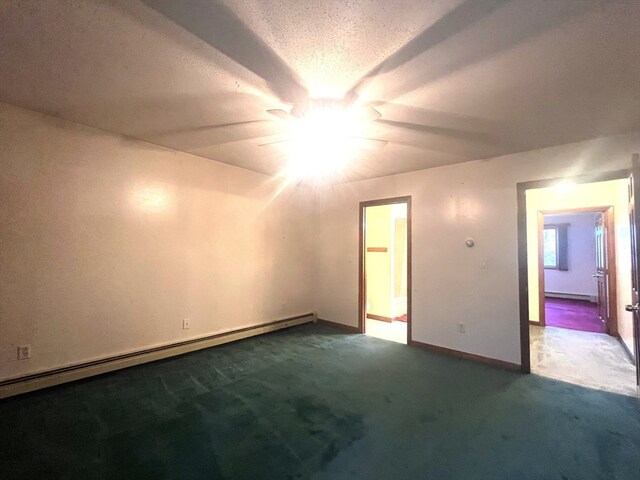 interior space with a baseboard radiator, a textured ceiling, and dark colored carpet