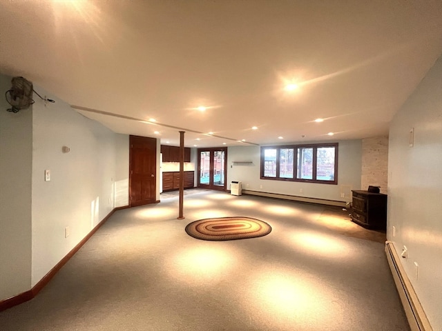 basement featuring carpet and a baseboard radiator