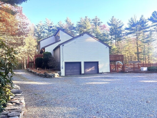 view of property exterior with a garage