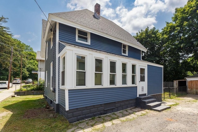 3 Aspen Ct, Ware, MA 01082 - view of property exterior featuring entry steps, a chimney, and a shingled roof