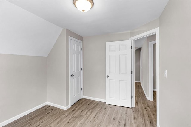 3 Aspen Ct, Ware, MA 01082 - additional living space with light wood-style flooring and vaulted ceiling