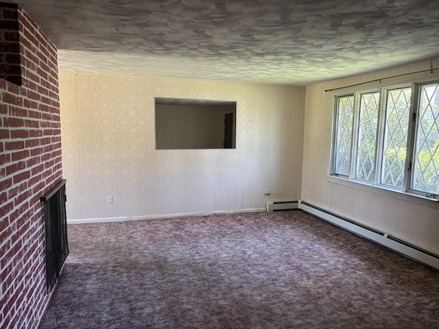 carpeted empty room with baseboards, a textured ceiling, a baseboard heating unit, and a fireplace