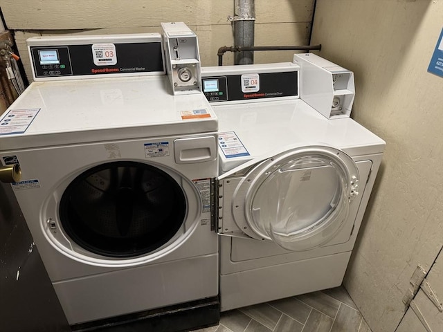 washroom featuring washer and clothes dryer