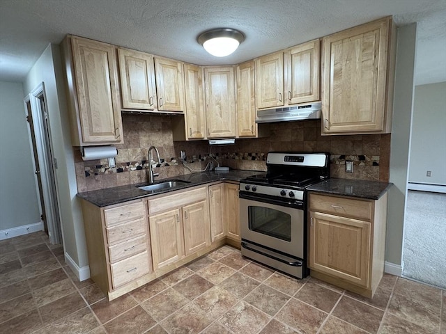 kitchen with decorative backsplash, gas range, a textured ceiling, and sink