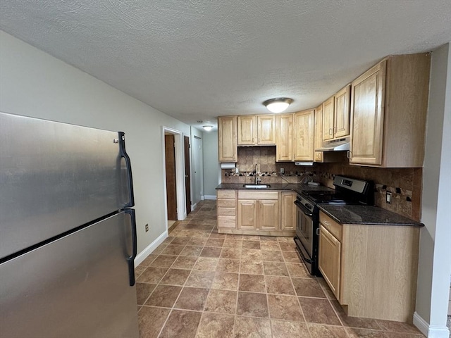 kitchen with decorative backsplash, stainless steel fridge, black stove, and light brown cabinets