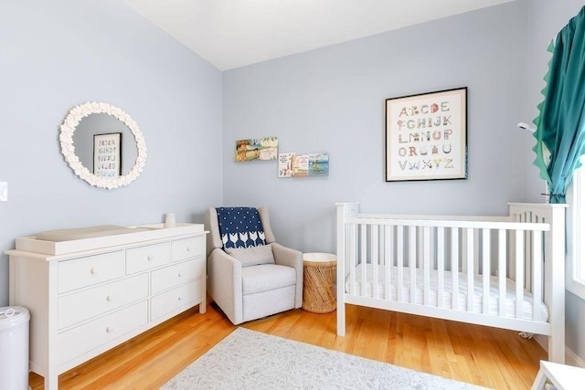 474 E 3rd Unit 2, Boston, MA 02127 - bedroom featuring wood finished floors and a nursery area