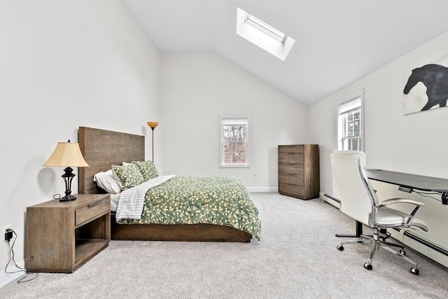 carpeted bedroom featuring lofted ceiling with skylight