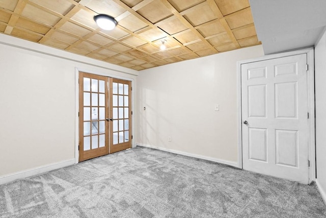 unfurnished room with french doors and light colored carpet