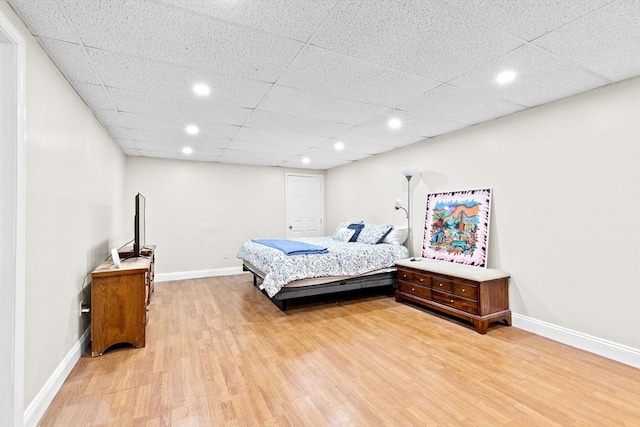 bedroom with hardwood / wood-style floors