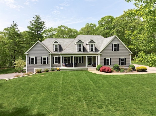2 Powers Rd, Mendon, MA 01756 - view of front of home featuring covered porch, a front lawn, and view of wooded area