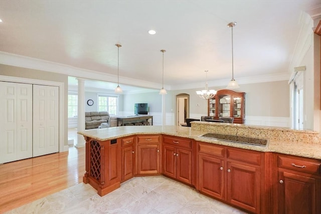 2 Powers Rd, Mendon, MA 01756 - kitchen with black electric cooktop, crown molding, light stone countertops, brown cabinetry, and open floor plan