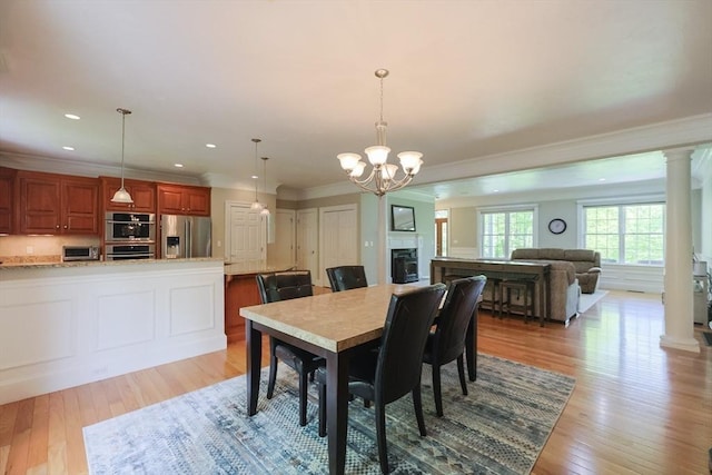 2 Powers Rd, Mendon, MA 01756 - dining area with light wood-style floors, a chandelier, ornamental molding, ornate columns, and recessed lighting