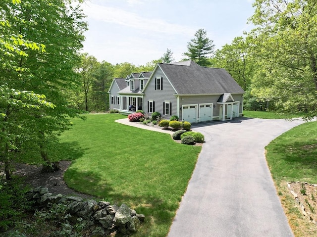2 Powers Rd, Mendon, MA 01756 - cape cod-style house featuring driveway, a front yard, and an attached garage
