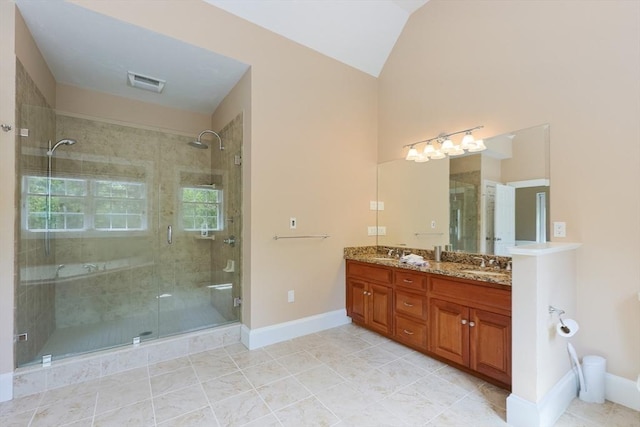 2 Powers Rd, Mendon, MA 01756 - full bathroom with vaulted ceiling, a shower stall, baseboards, double vanity, and tile patterned floors