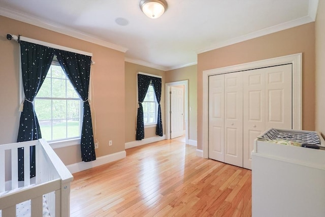 2 Powers Rd, Mendon, MA 01756 - unfurnished bedroom with light wood-type flooring, crown molding, baseboards, and a closet