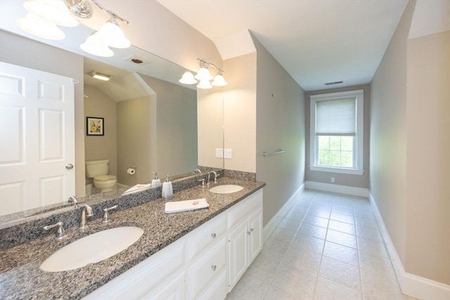 2 Powers Rd, Mendon, MA 01756 - bathroom with toilet, baseboards, tile patterned flooring, vaulted ceiling, and double vanity