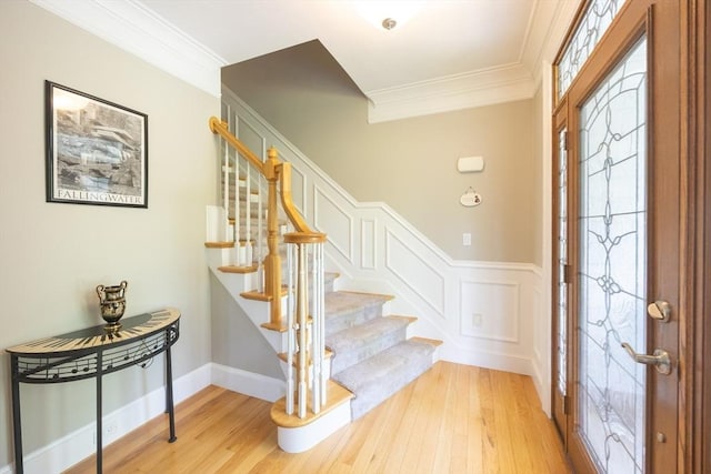 2 Powers Rd, Mendon, MA 01756 - entryway with light wood-style flooring, crown molding, stairway, and wainscoting